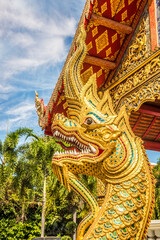 Fototapeta na wymiar View at the Wat Phra Singh Woramahawihan in the streets of Chiang Mai - Thailand