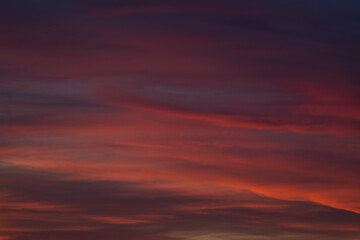 Fototapeta premium Dramatic sunset with vibrant clouds lit by a sun