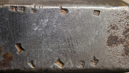 Anvil surface with scratches and traces from hammer. rough steel background. grunge metal texture
