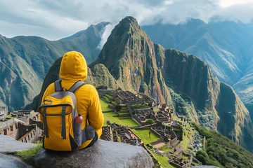 Foto op Canvas Traveler looking at Machu Picchu Inca ancient civilization ruins in Peru, aerial view scenic picturesque © Roman