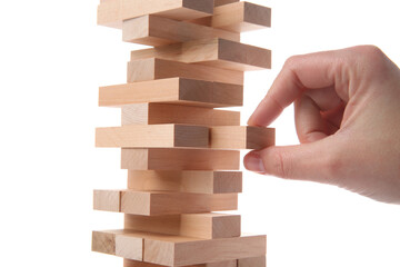 Woman playing Jenga on white background, closeup