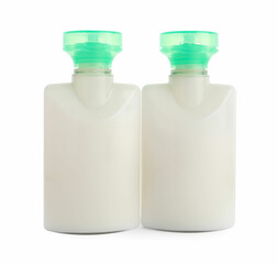 Mini bottles of cosmetic products isolated on white