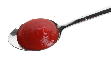 Spoon with tasty ketchup isolated on white, above view. Tomato sauce