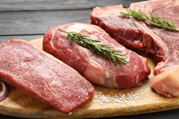 Pieces of raw beef meat on table, closeup