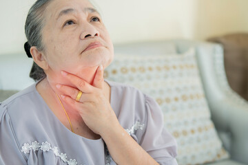 Closeup portrait sick old woman, having severe infection, chest pain, looking miserable unwell, trying to catch her breath.