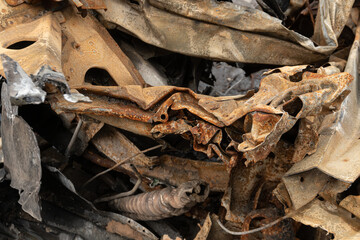 Burnt car metal, scrap metal, close-up.