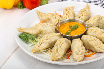 Steamed asian dumpling momo with meat