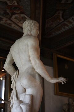 Florence, Italy - February 8, 2024: Doryphoros statue at Uffizi gallery, low angle view
