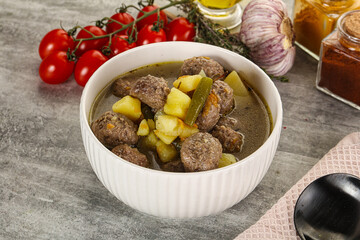 Soup with meatball and potato