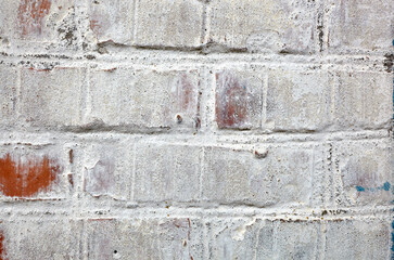 Red white wall background. Old grungy brick wall texture. Vintage wall with obsolete plaster