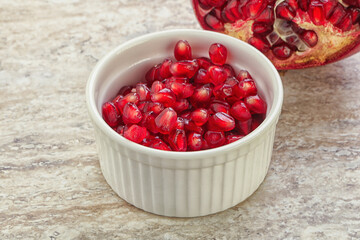 Ripe red Pomegranate seeds in the bowl