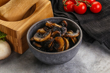 Roasted champignon mushrooms in the bowl