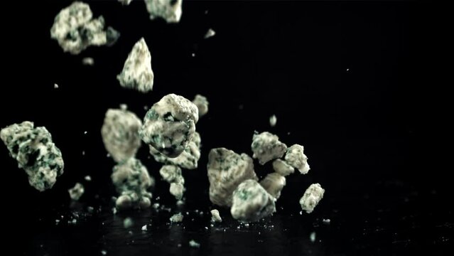 Super slow motion blue cheese on black background. Filmed on a high-speed camera at 1000 fps. High quality FullHD footage