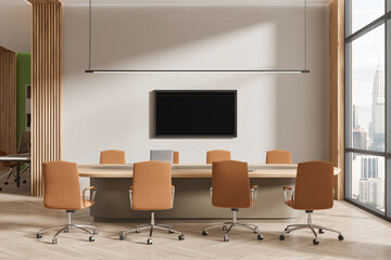 Cozy meeting interior with table and chairs, tv display and panoramic window