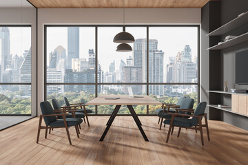 Stylish meeting interior with table and chairs, tv screen and panoramic window