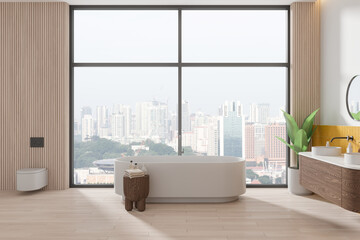 Stylish home bathroom interior with tub, toilet and sink near panoramic window