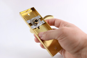 A handle on a slat for an interior door on a white background.