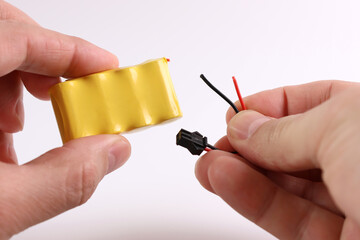 The cable is disconnected from the battery. Power loss concept. Repair of small electronics.
