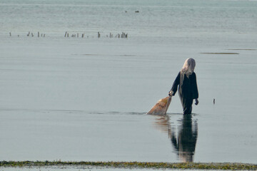 Fisherman on mudflat in Zanzibar