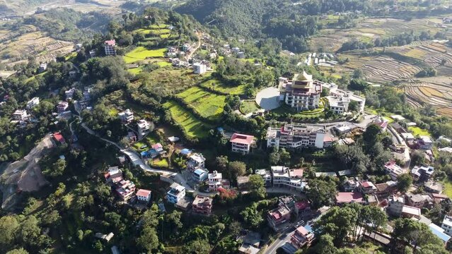 Aerial view of Kathmandu city, Nepal, showcasing the densely packed buildings and the majestic Himalayan mountains in the background.