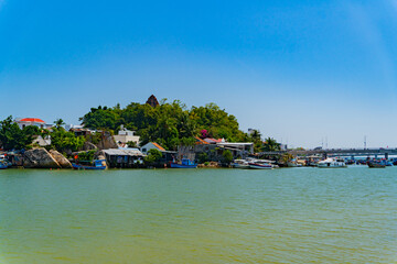 Houses on the river bank.The Kai River in Nha Trang in Vietnam. The urban landscape.