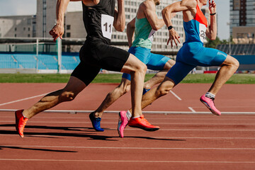 group male athletes sprinting on red track stadium, muscles taut, competing fiercely. summer sports...