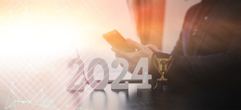 businessman thinking about investments in 2024 at a laptop, investment leader