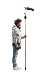 Full length profile shot of a boom operator holding a microphone © Ljupco Smokovski