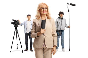 Female reporter with a microphone and boom and camera operators with recording equipment © Ljupco Smokovski