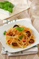 Spaghetti with turkey meat and chinese mushrooms.