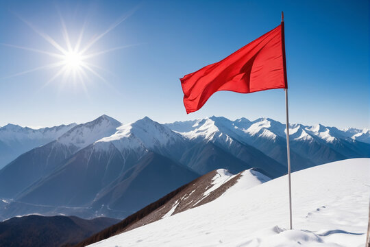A red flag on snowy mountain peak, background for business achievements concept