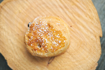 A beautiful gourmet scone served with tea and coffee, strawberry jam and clotted cream. traditional...