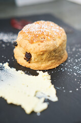 A beautiful gourmet selection of english afternoon tea cakes and scones served with organic...