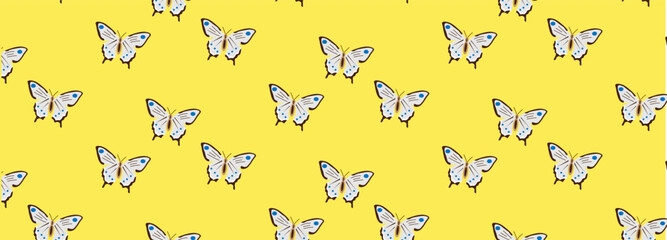 butterflies seamless pattern on a yellow background