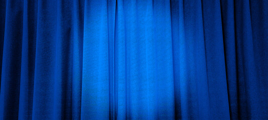 close up view of blue curtain in thin and thick vertical folds made of black out sackcloth fabric,...