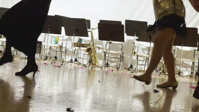 Girls legs video Expression dancing swing dance in the empty ball hall. Women dressed sexy dresses, stockings, high heels shoes. Retro style funny time spending 4K footage.