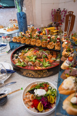 Delectable buffet spread of seafood, sushi, salads, fruit, and pastries.