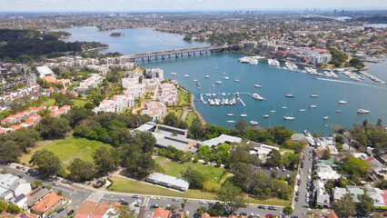 Aerial drone view over Balmain in Sydney, New South Wales, Australia looking toward Sommerville Point and Birkenhead Point on a sunny day    