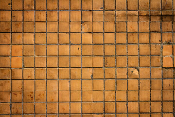 Old brown small tile wall