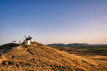 Group of ancient windmills in the town of Consuegra Spain , on the route of the Don Quixote and...