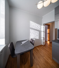 KItchen in the modern flat. Light from the window.