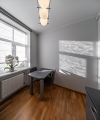 KItchen in the modern flat. Light from the window.