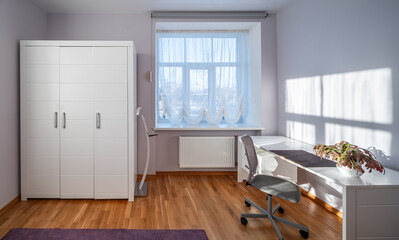 Living room in the modern flat. Lighti from th ewindow.