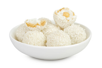 round candy raffaello with coconut flakes and nut in ceramic bowl isolated on white background