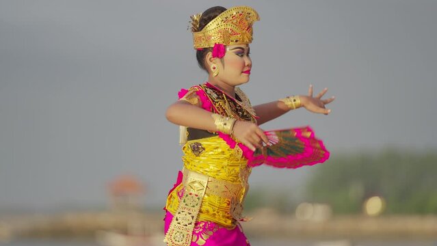 Balinese dancer with fan, authentic cultural dance, indonesian culture, bali