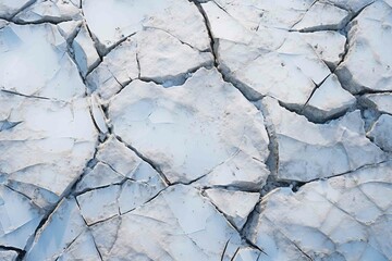 Ice wedging cracks in a rock surface