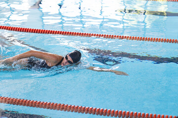Swimmer in action at an indoor pool