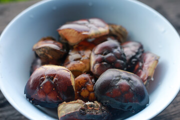 Selective focus Many field crab are peeled, washed, and cleaned for cooking in a stainless steel container. Simple, natural food from rural farmers in