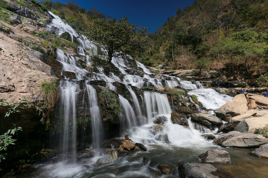 Mae Ya Waterfall in Chiang Mai Province is a beautiful waterfall with water all year round and very high. Waterfall in a beautiful forest park in Thailand In February 2024