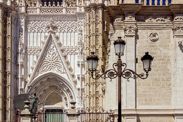 exterior architecture of Cathedral church in Seville, Spain - 744583122